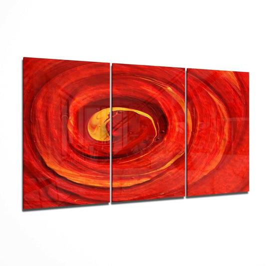 Three-panel red glass wall art with concentric swirling loops in red and golden-yellow tones, displayed at an angle.