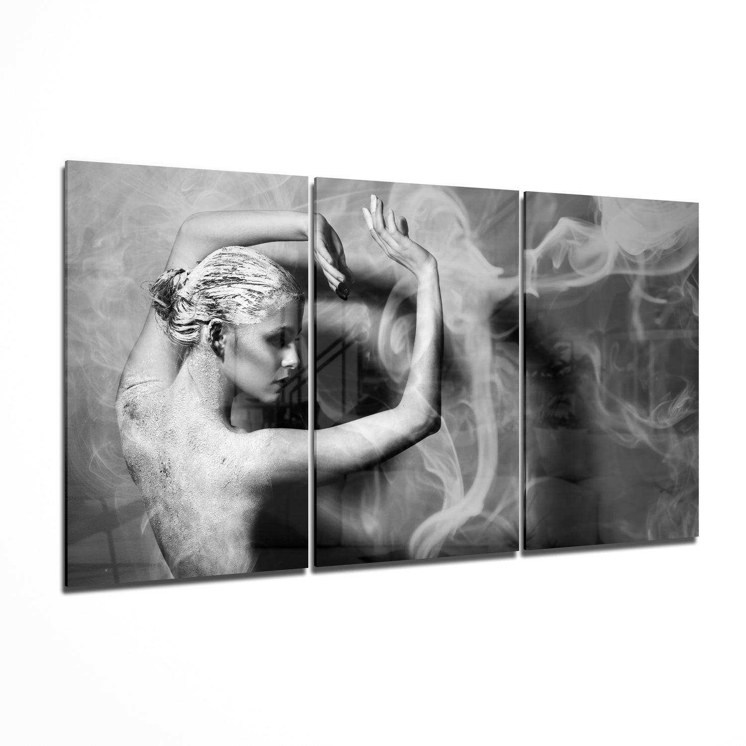 Three-panel black and white glass wall art showing a shirtless man in profile with raised hands against smoky background.
