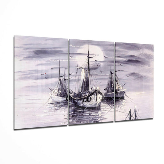 Three-panel glass wall art depicting moored sailing ships in lavender and gray tones under a cloudy sky, displayed at an angled perspective.