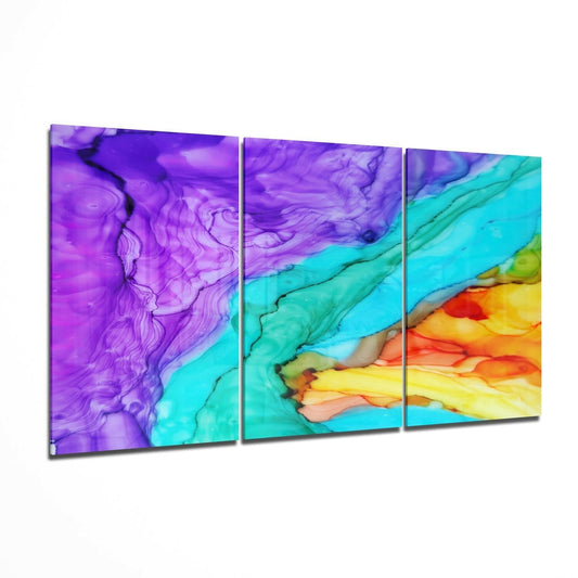 Three-panel glass wall art displaying flowing purple ink transitioning to turquoise and yellow-orange gradients on angled display.