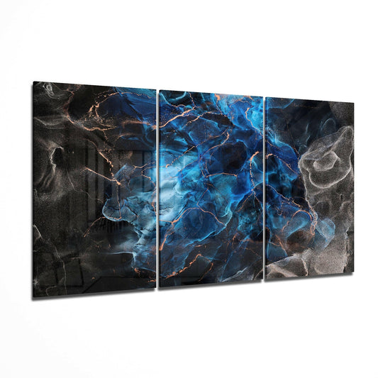 Three-panel blue and copper abstract glass art displayed at an angle, showing cracked marble texture with glowing veins.