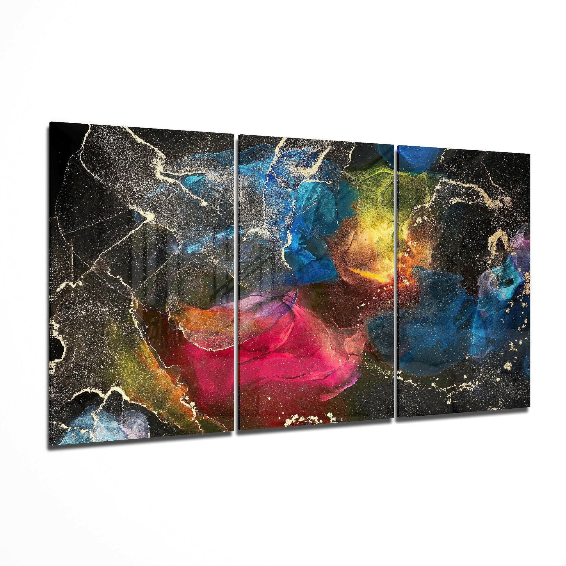 Three-panel glass art displaying vibrant swirling colors—blues, pinks, yellows, and golds—with metallic gold accents on dark background.