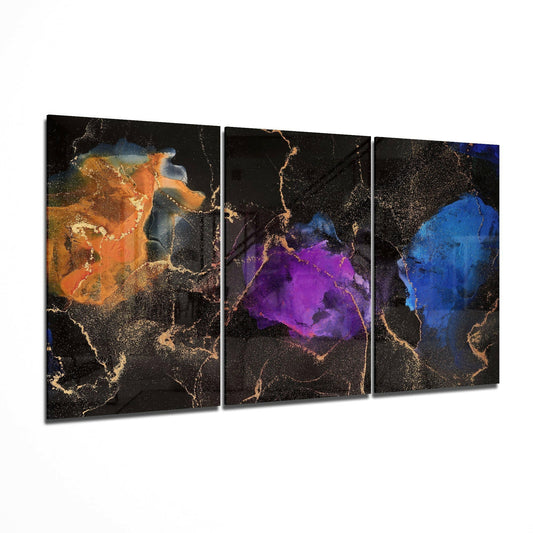 Three-panel glass art displaying abstract watercolor effects in orange, purple, and blue with gold crackle veining on black background.