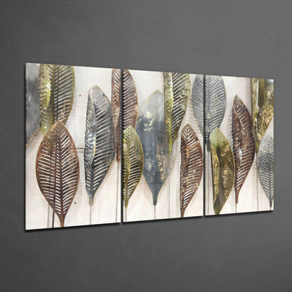 Multi-panel glass artwork displaying stylized leaves in brown, gold, and gray tones mounted on gray wall.