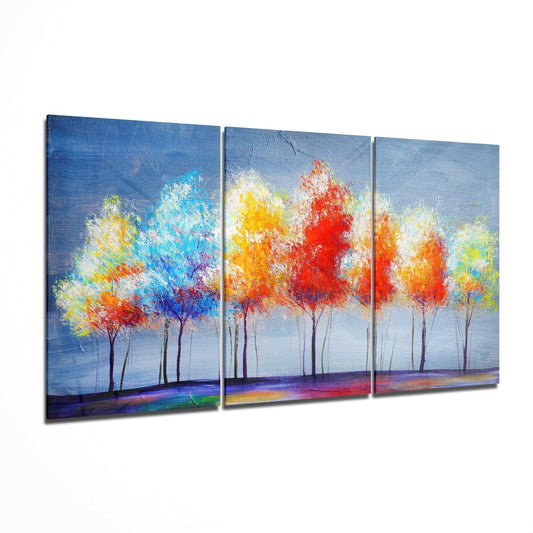 Three-panel glass art depicting vibrant colorful trees with red, yellow, and blue foliage against a blue sky and colorful ground.