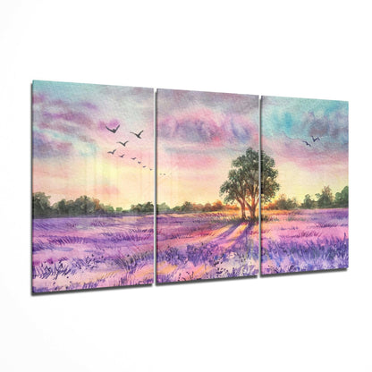 Three-panel glass art depicting a lavender field at sunset with a solitary tree, flying birds, and purple, pink, and golden sky tones.