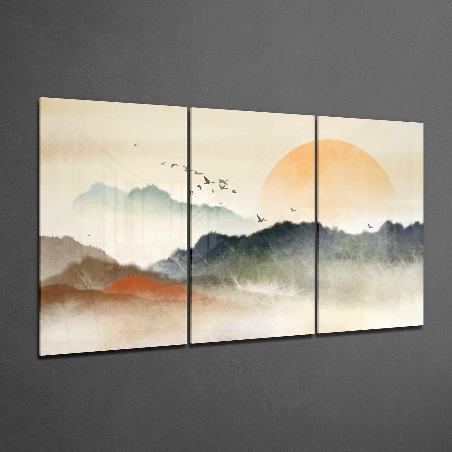 Three-panel glass art depicting misty mountains, an orange sun, and birds in flight against a cream sky.