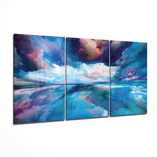 Three-panel glass art featuring a surreal seascape with blue water, pink and purple clouds, and dramatic sky reflections.
