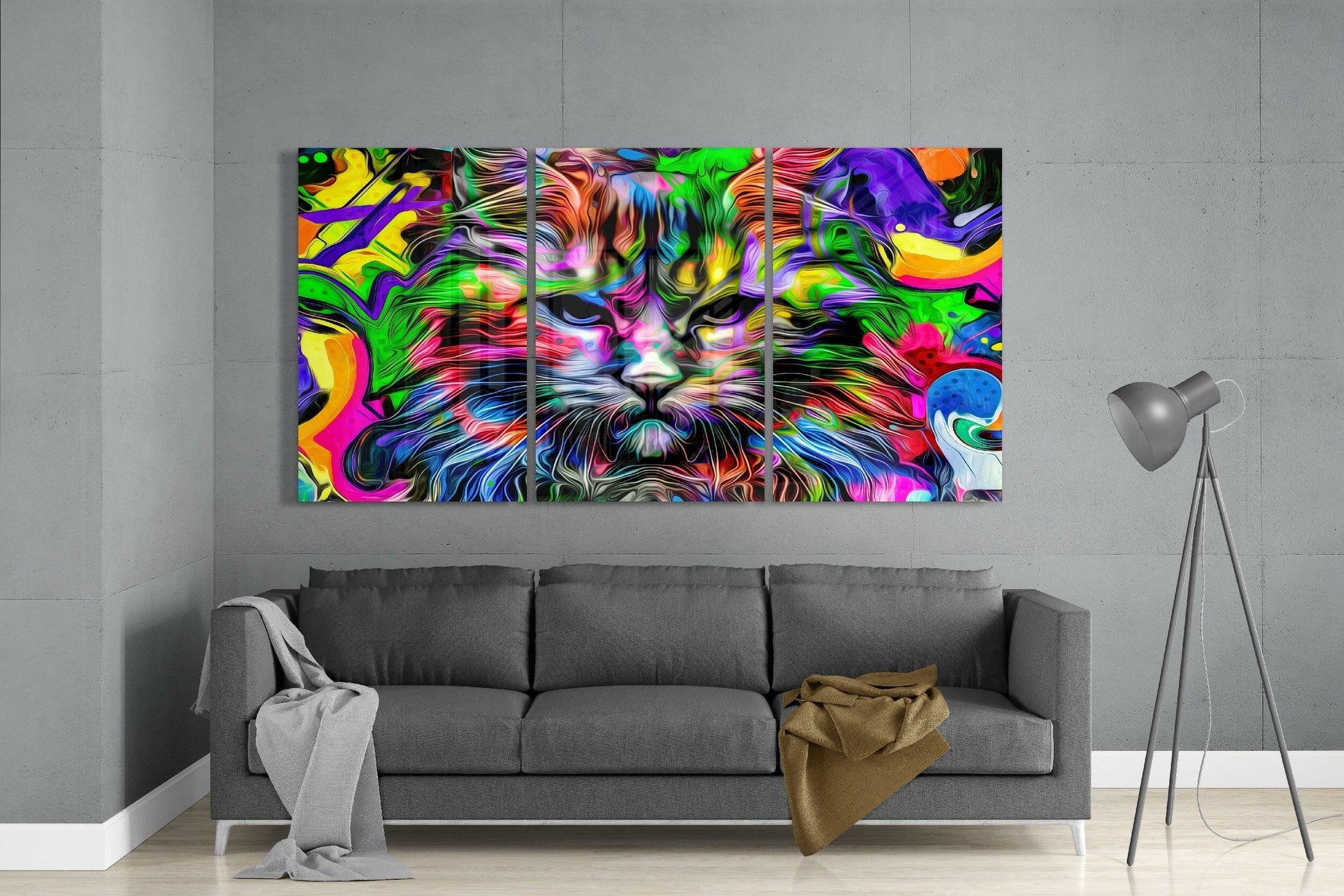 Vibrant three-panel colorful cat glass art display mounted above gray sofa in modern living room interior.