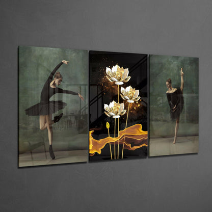 Three-panel glass art display featuring ballet dancers in black tutus on side panels and glowing gold lotus flowers with golden ribbons on black background in center panel.