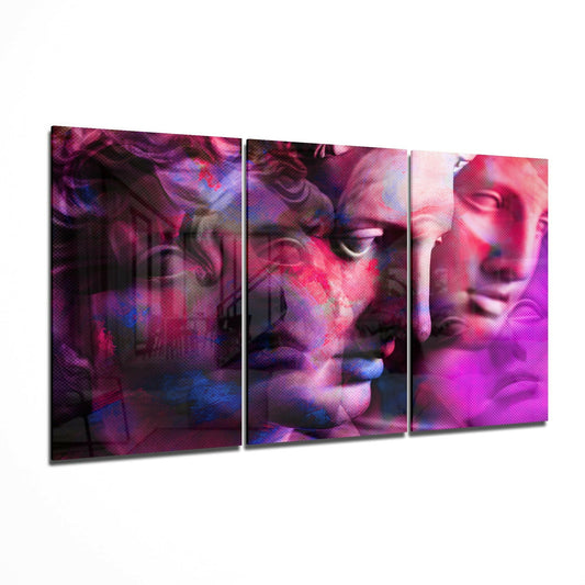 Three-panel glass wall art displaying classical statue faces with magenta, pink, and blue glitch effects, viewed at an angle.