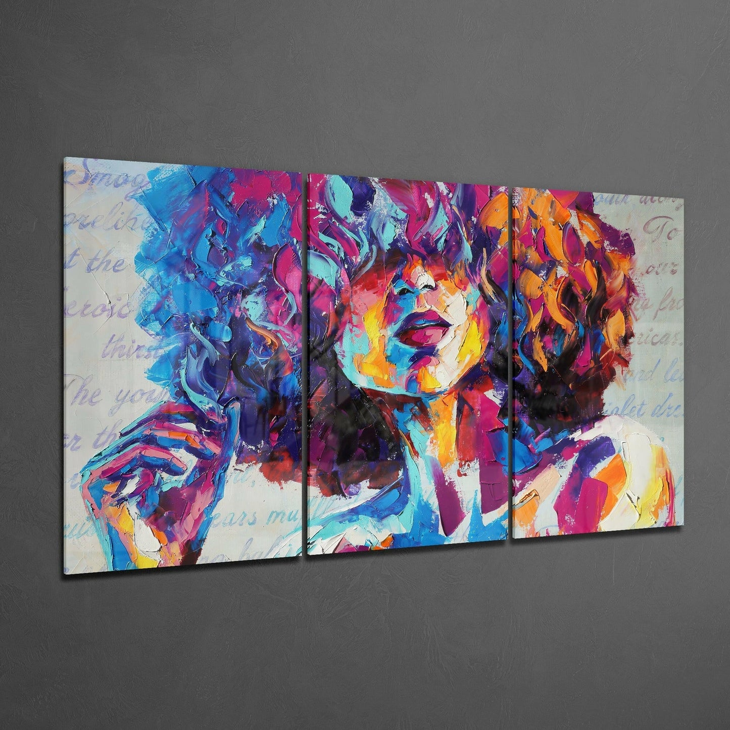 Three-panel colorful glass art depicting an abstract portrait with vibrant blue, pink, orange, and purple brushstrokes on gray wall.