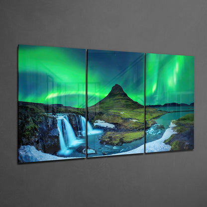 Three-panel glass art displaying Icelandic landscape with green aurora borealis, waterfall, mountain, and turquoise water.