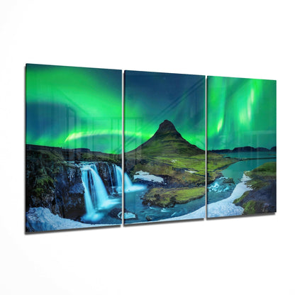 Three-panel glass art display featuring Iceland landscape with green aurora borealis, waterfall, mountain peak, and glacial rivers.