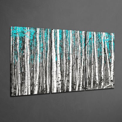 Two-panel birch forest glass art with white tree trunks and bright turquoise sky, displayed at angle on gray wall.