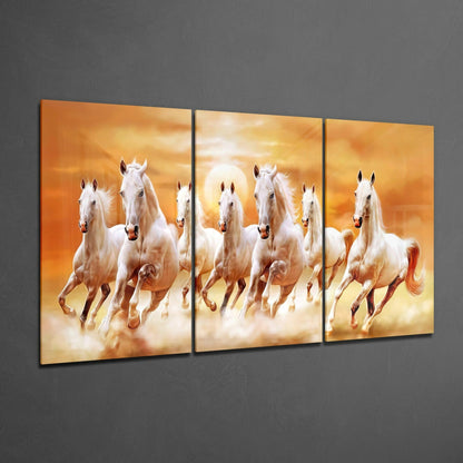 Three-panel glass art displaying white horses galloping through golden clouds against an orange sunset background.