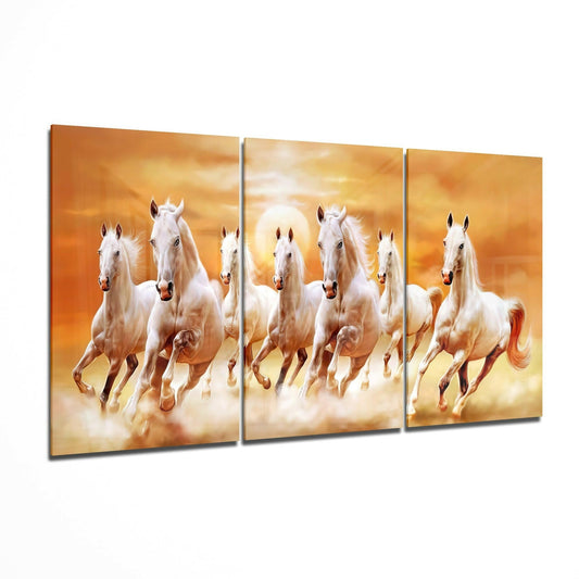 Three-panel glass art depicting seven white horses galloping through golden clouds at sunset.