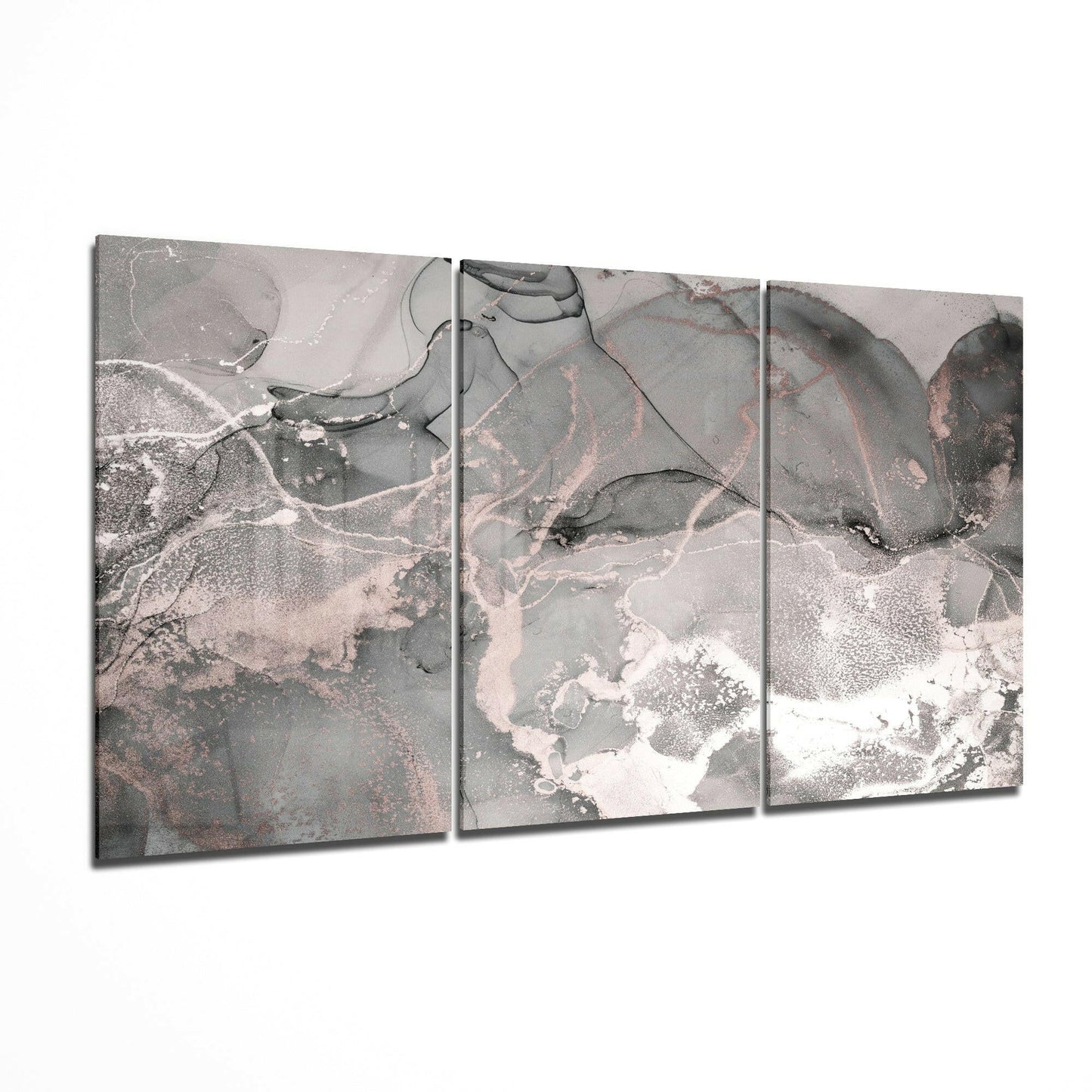 Three-panel gray glass art displaying abstract aerial landscape with white, pink, and dark gray tones and organic flowing patterns.
