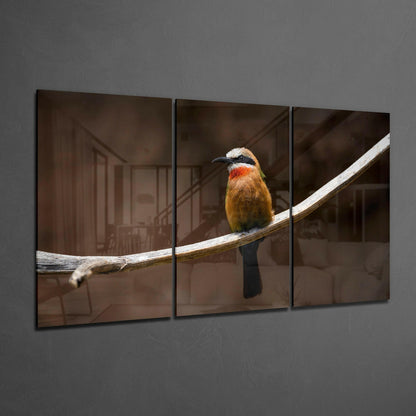 Three-panel glass art displaying a colorful bee-eater bird perched on a white branch against a blurred brown interior background.