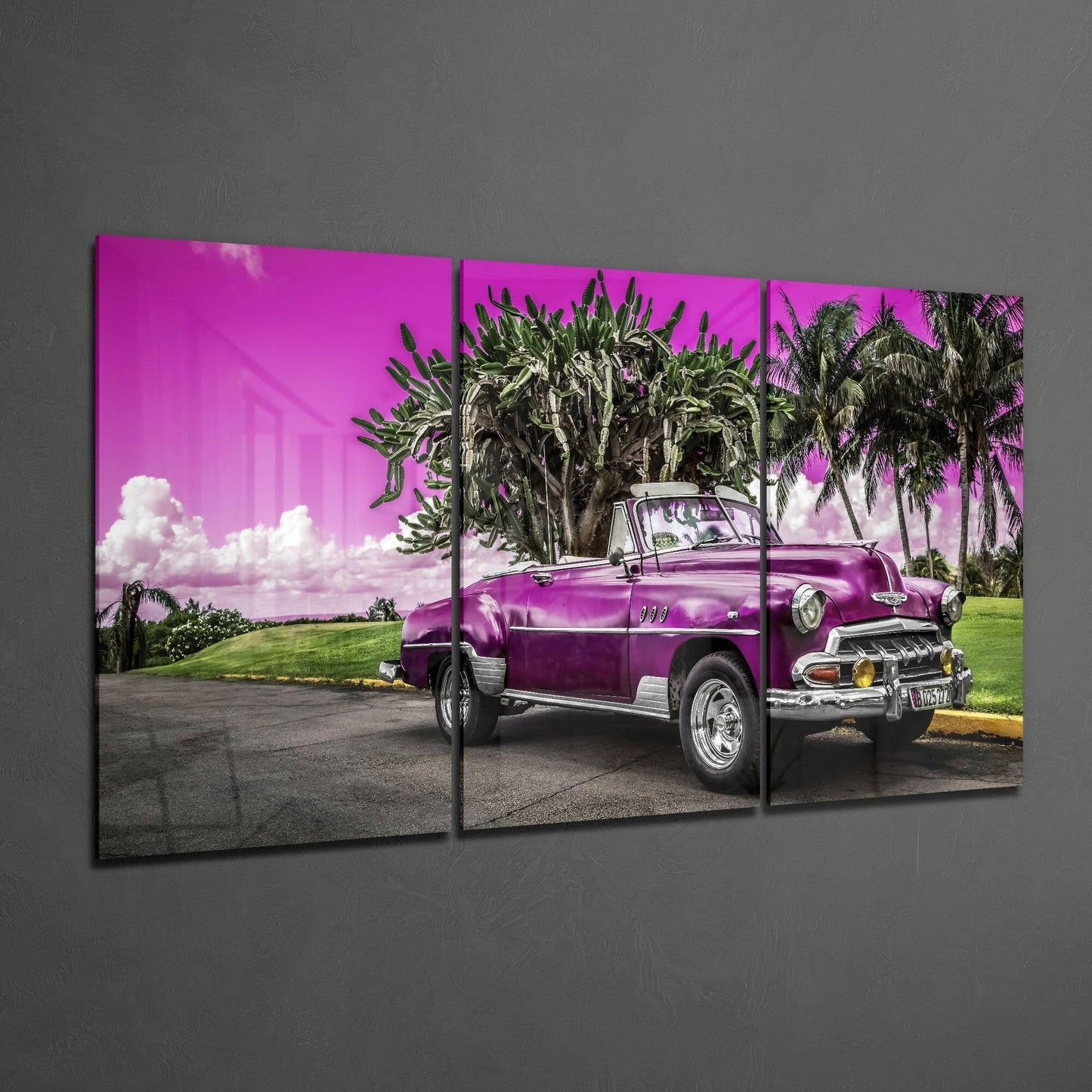 Three-panel glass art displaying a purple vintage convertible car parked beneath palm trees against a magenta sky.