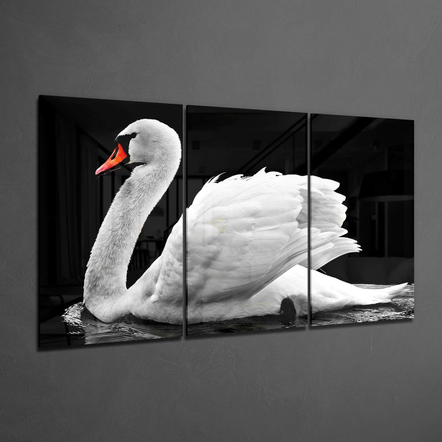 Three-panel black glass artwork displaying a white swan with orange beak in profile against dark background.