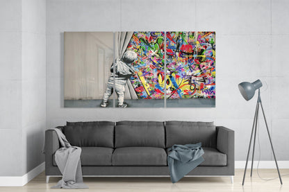 Modern living room interior featuring a three-panel glass wall art above gray sofa depicting a child pulling back curtains to reveal vibrant multicolored graffiti.