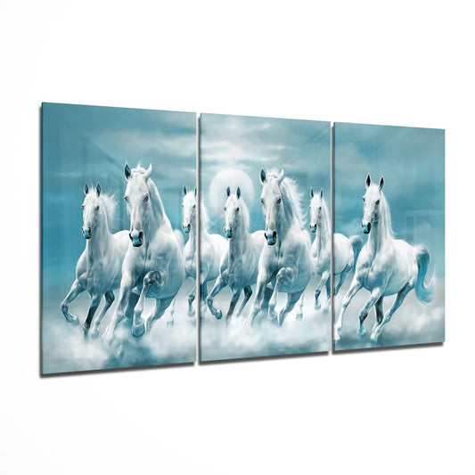 Three-panel glass wall art displaying white horses galloping through clouds against a turquoise sky background.