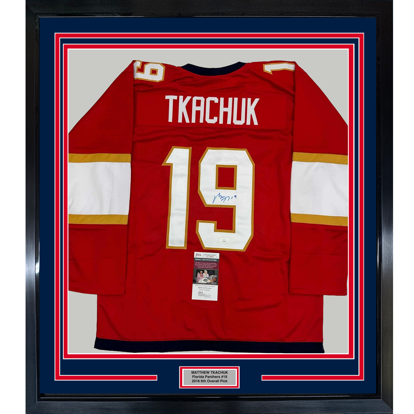 Framed red Florida Panthers hockey jersey number 19 with "TKACHUK" nameplate and signature, displayed front-facing with JSA authentication certificate visible.