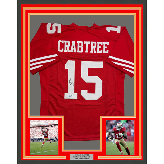 Red San Francisco 49ers jersey number 15 with "CRABTREE" name and autograph displayed in gold-bordered frame with action photos.