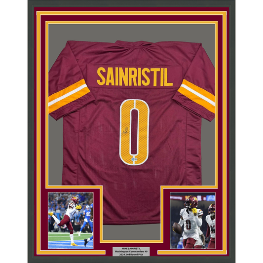 Framed burgundy football jersey displaying "SAINRISTIL" and number "0" with gold and white stripes, flanked by two action photographs and nameplate.