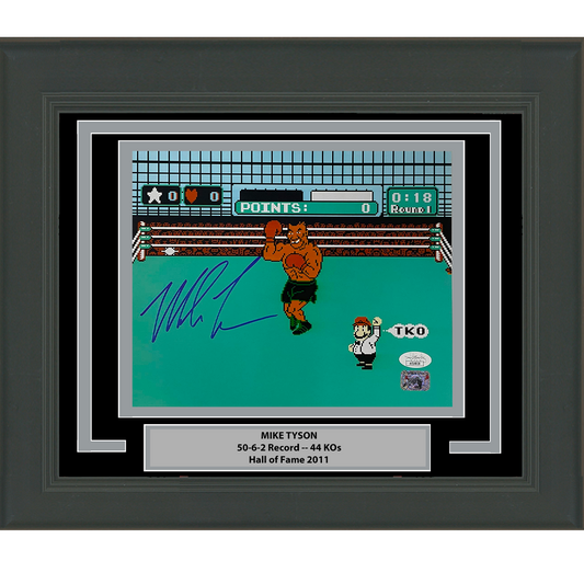 Framed Mike Tyson autographed Mike Tyson's Punch-Out screenshot showing boxer in ring with blue signature on turquoise background.