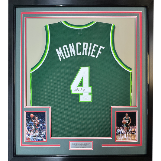 Back view of framed green Milwaukee Bucks #4 basketball jersey signed by Sidney Moncrief, with two player photos below.