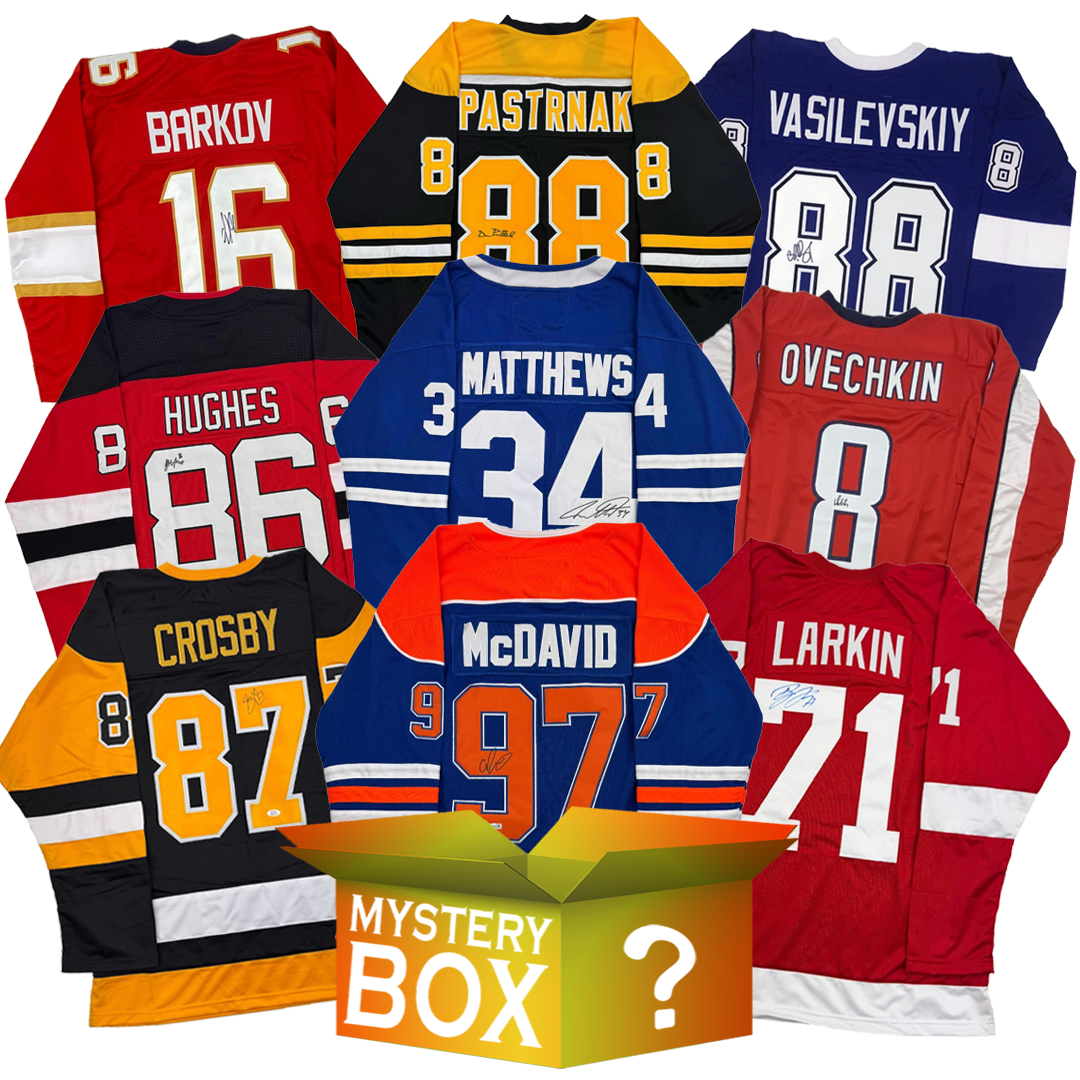 Nine autographed hockey jerseys in red, blue, black, orange, and navy arranged in circle around central mystery box with question mark.
