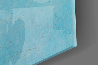 Close-up angled view of light blue textured glass panel showing surface detail and layered edges against gray background.