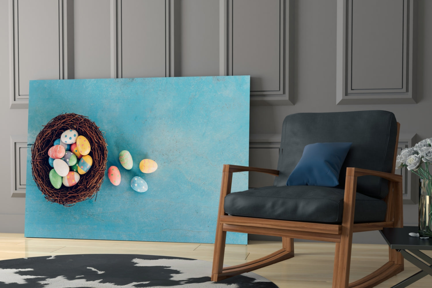 Easter egg glass wall art depicting a brown nest with colorful painted eggs on turquoise background, displayed in modern interior with wood chair.