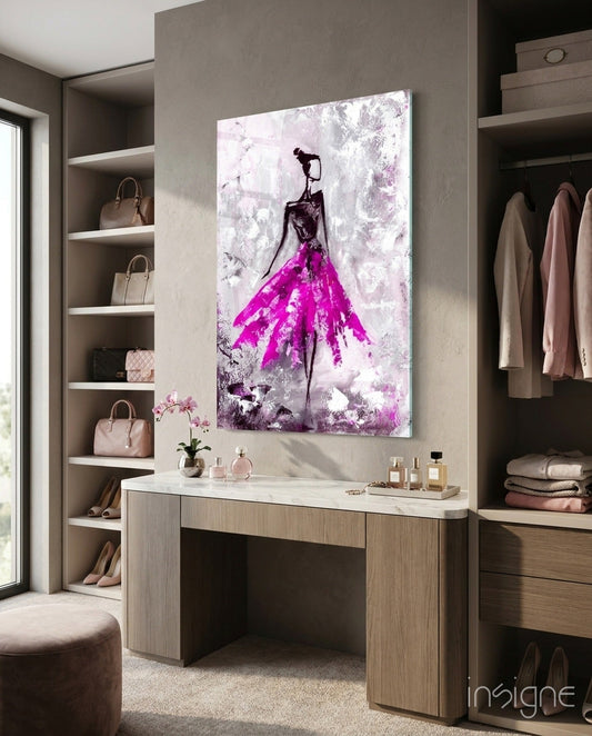 Magenta ball gown sketch artwork displayed above a wooden vanity desk in a luxury closet with built-in shelving.