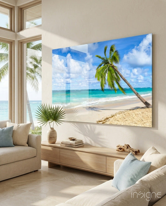 Tropical beach glass wall art displaying palm tree and turquoise ocean displayed in modern living room.