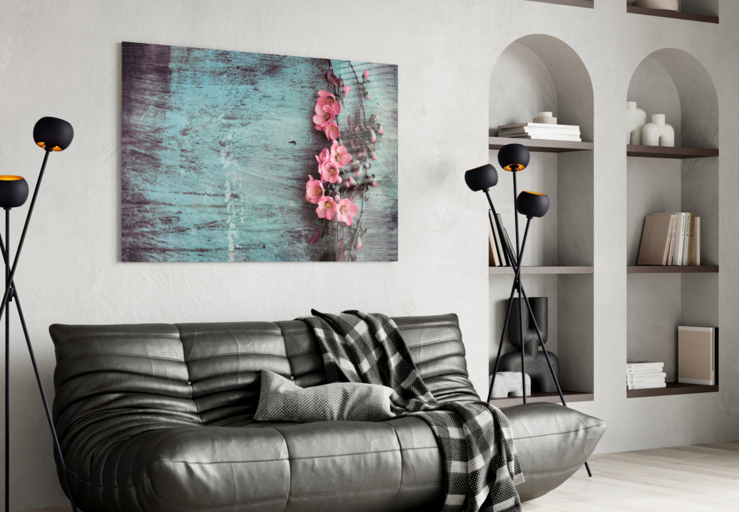 Pastel Flower Glass Wall Art featuring pink roses on turquoise distressed wood displayed above a black leather sofa in a modern living room interior.