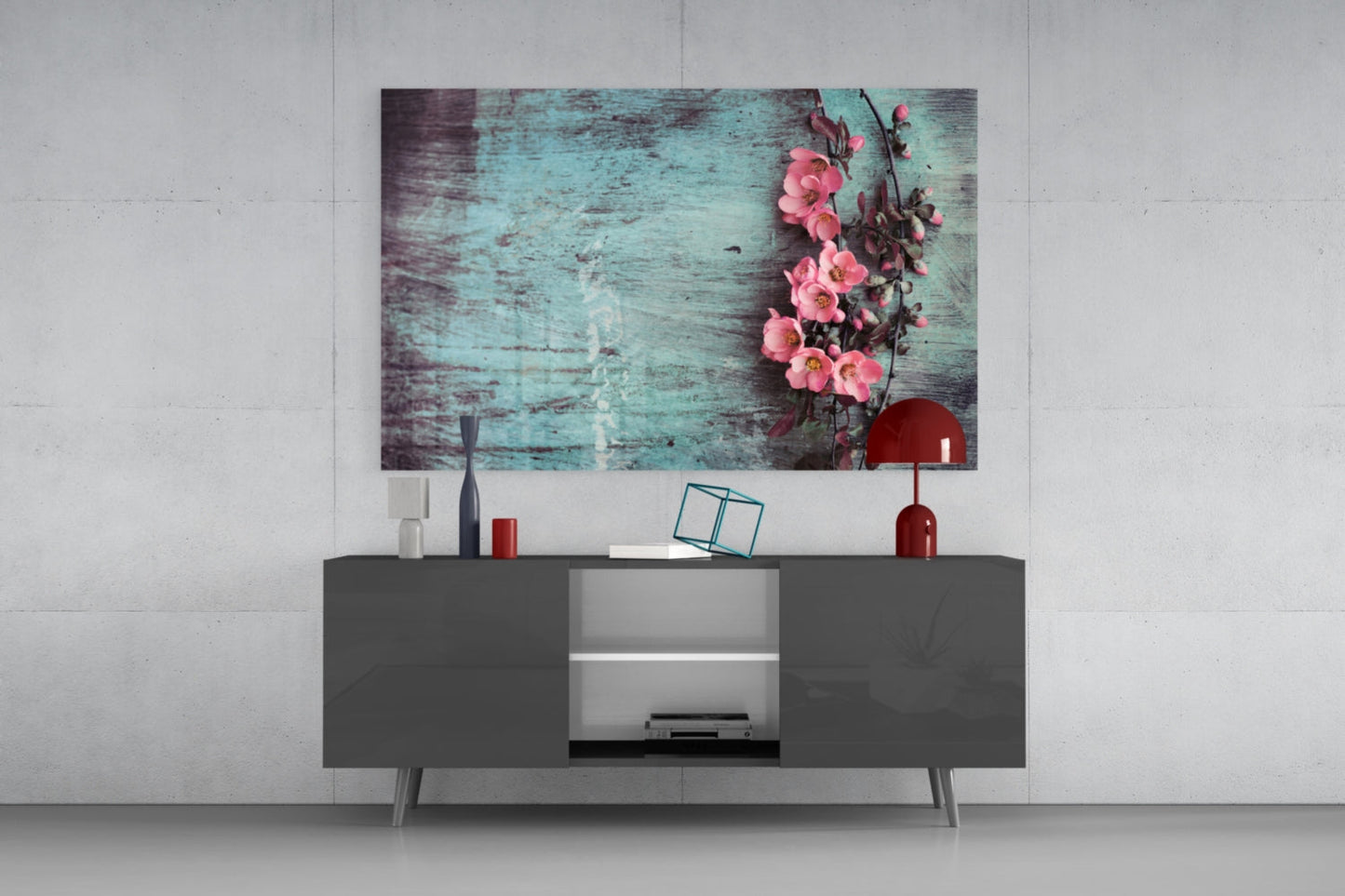 Pastel Flower Glass Wall Art displaying pink flowers on turquoise wood texture, hung above a dark gray media console in a modern interior setting.