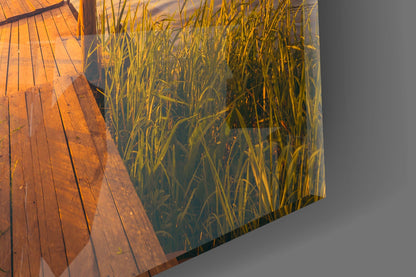 Sunset Rowboat Grassy Dock Glass Wall Art