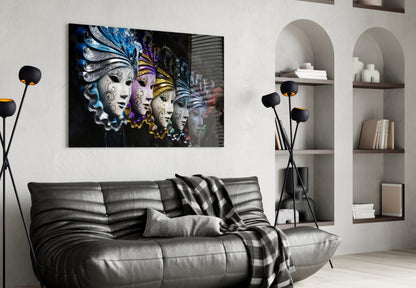 Venetian carnival masks glass wall art hanging above gray leather sofa in modern living room with white shelving and black floor lamp.