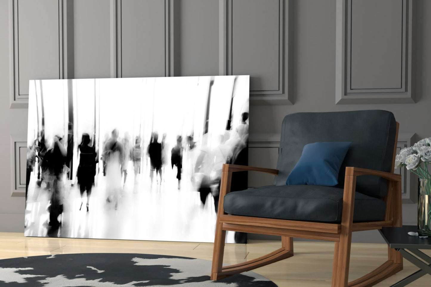 Black and white glass wall art depicting blurred crowd of people displayed in modern living room beside wooden chair.