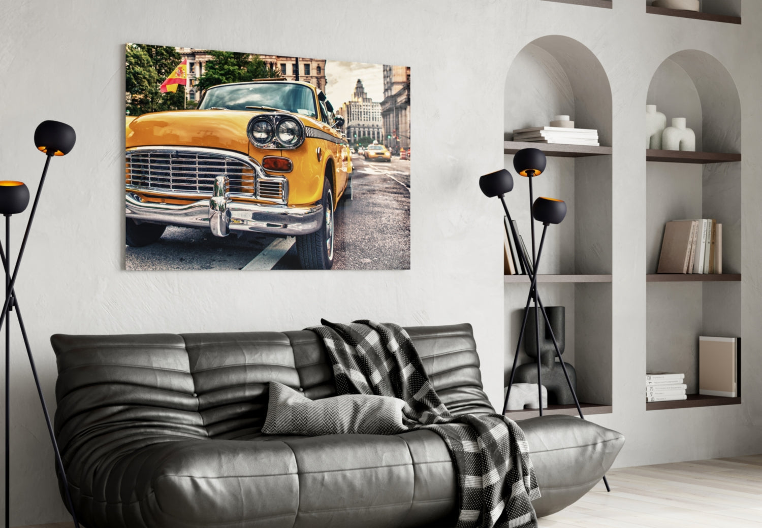 Yellow vintage taxi cab glass wall art displayed above black leather sofa in modern living room interior.