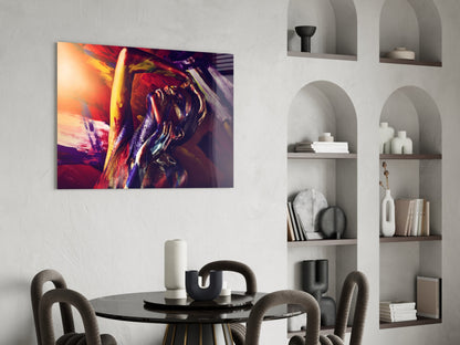Vibrant abstract portrait with red, purple, and gold tones displayed as glass wall art above a round black dining table.