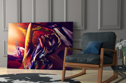 Colorful abstract glass wall art featuring a woman's portrait in red, gold, and purple tones displayed in a modern living room setting.