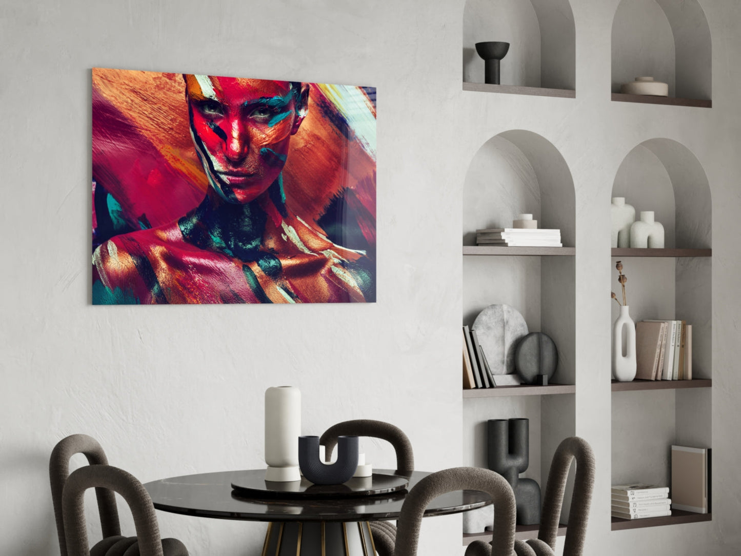 Vibrant glass wall art featuring a colorful portrait with red, orange, and teal tones displayed in a modern dining room setting.