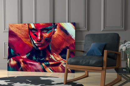 Vibrant glass wall art featuring a colorful portrait of a woman with red, orange, and teal paint strokes displayed in a modern living room setting.