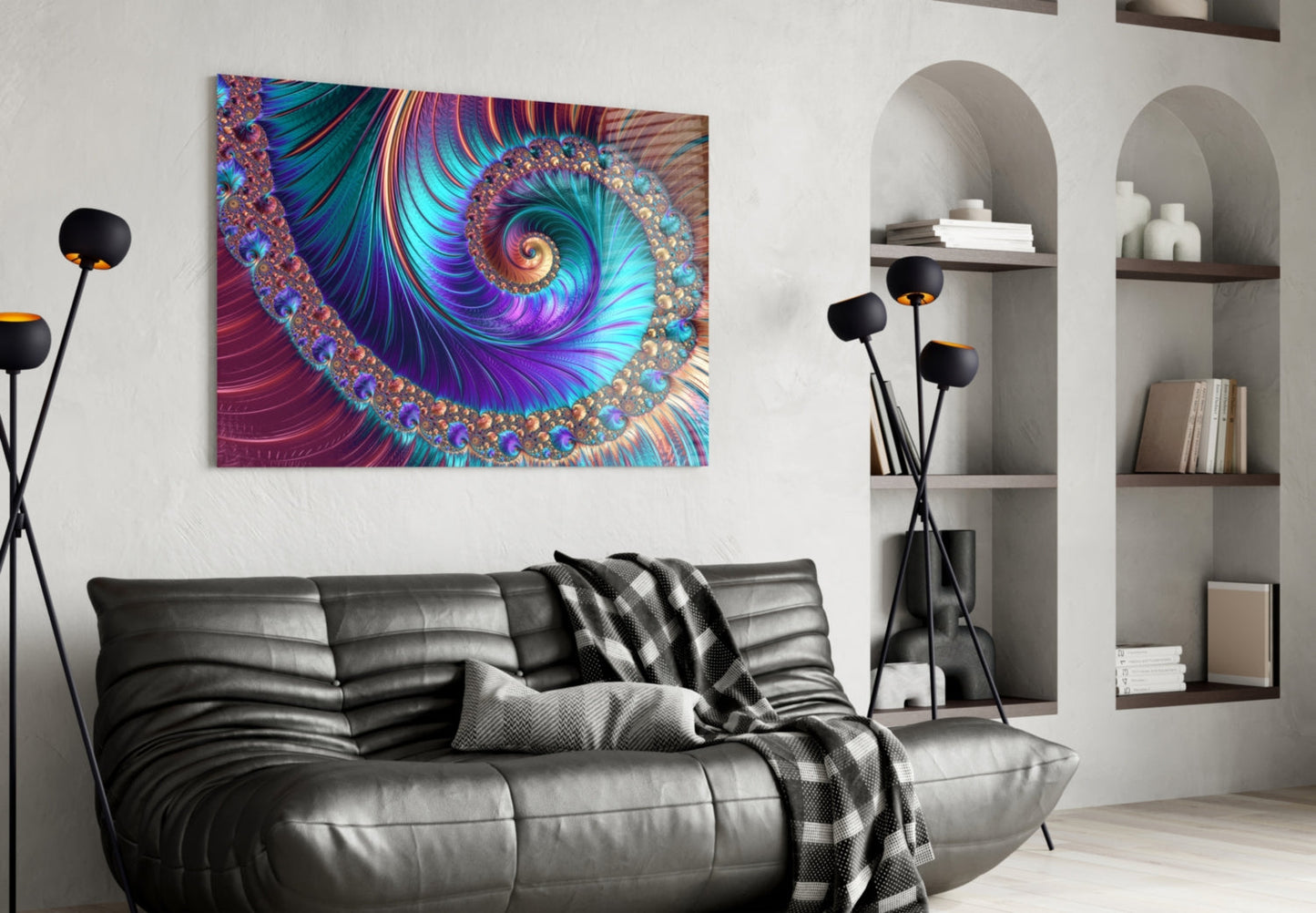 Vibrant abstract fractal spiral glass wall art in purple, teal, and gold displayed above a black leather sofa in a modern living room.