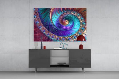 Colorful fractal spiral glass wall art with jeweled borders displayed above modern gray media console in minimalist interior.