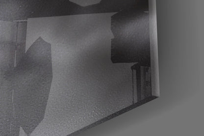 Close-up angled view of frosted glass wall art showing woman's profile silhouette in grayscale tones.